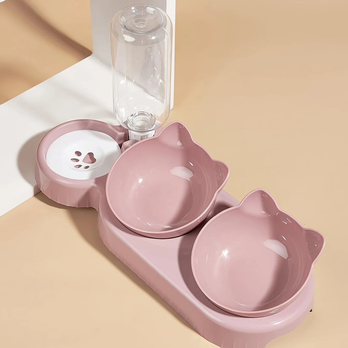 Pink 3-in-1 cat feeder set with two cat bowls and clear gravity water bottle