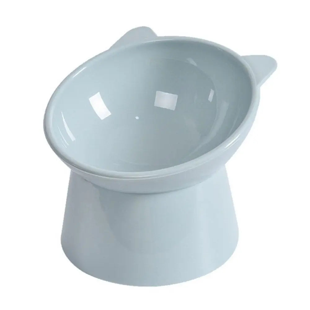 Elevated slanted pet feeder bowl, light teal, close-up of curved bowl.