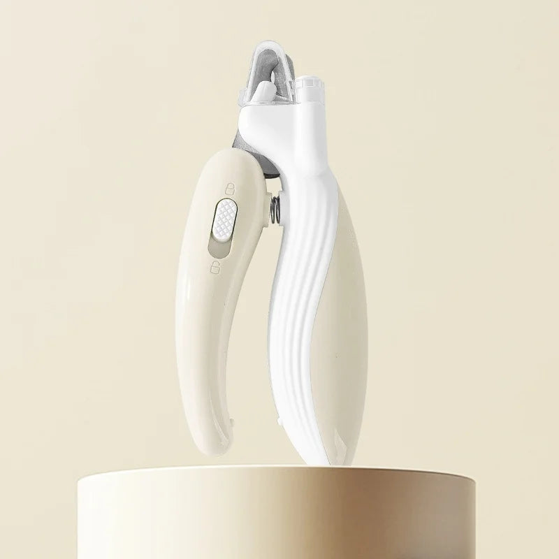 White pet nail clipper trimmer with curved handle and safety guard, free-standing