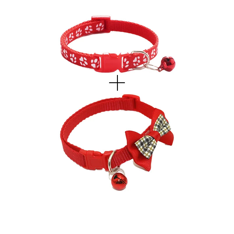 Two red cat collars with paw-print pattern and small bell charms