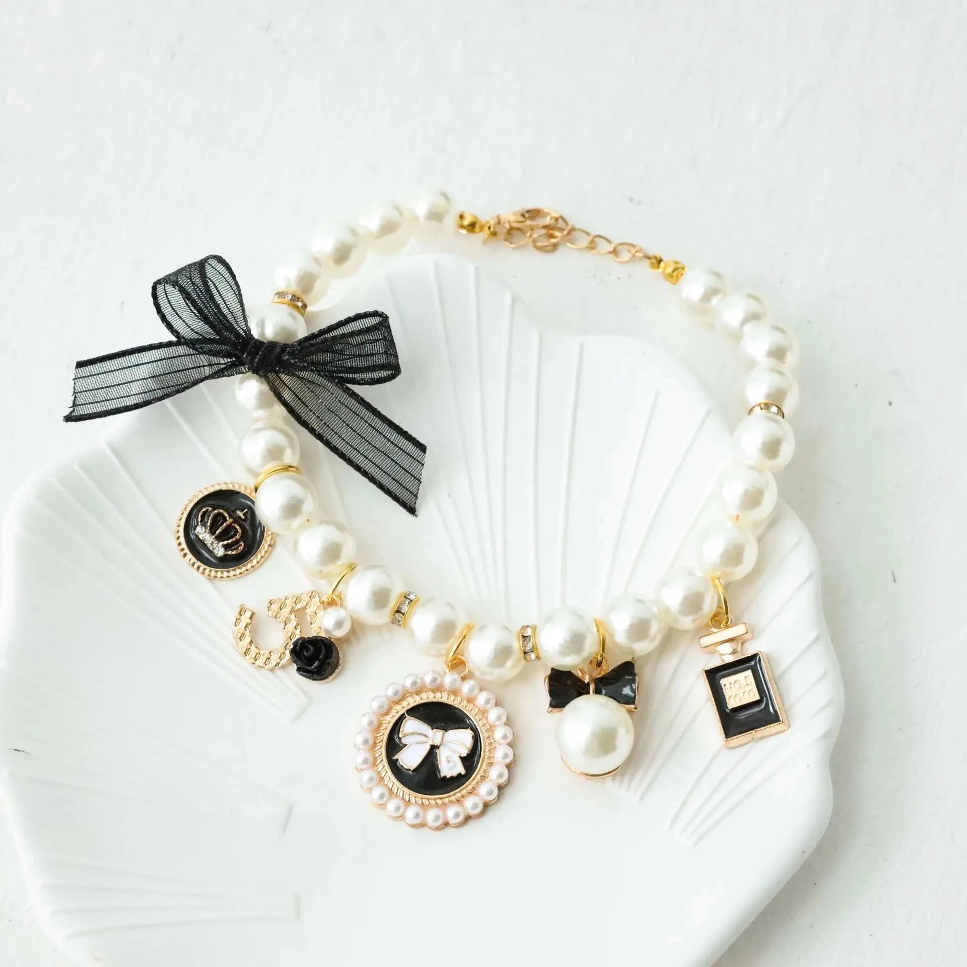 Pearl pet collar with black lace bow and dark round charms, white beads