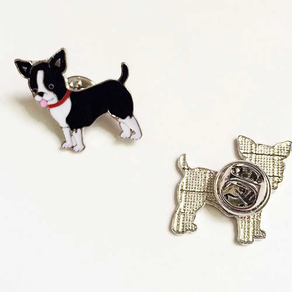 Cartoon black-and-white dog enamel pin with silver clasp back