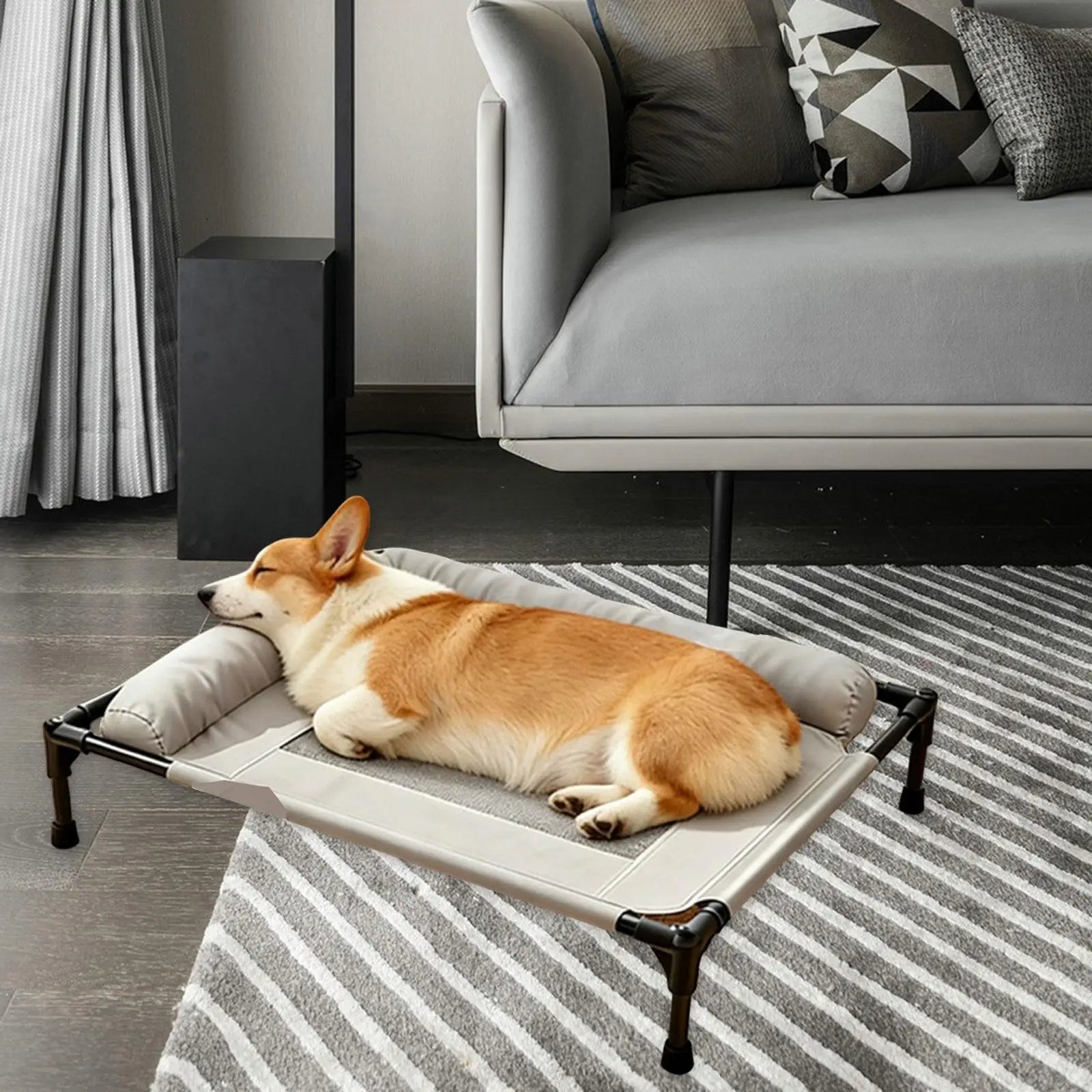 Gray elevated pet bed with black legs, cushioned frame, and breathable mesh center