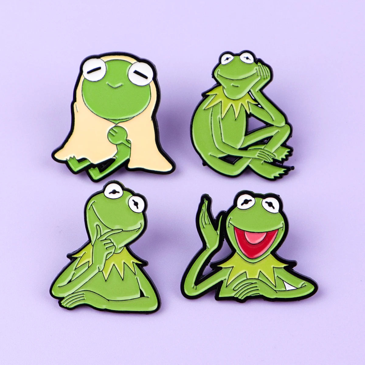 Four green animal enamel lapel pins in sitting and waving poses, set view