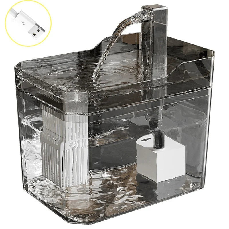 Clear tank cat water fountain with stainless pump outlet and flowing water stream