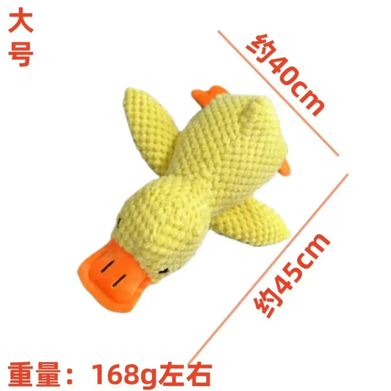 Yellow textured plush fish chew toy with orange fins and small black eye