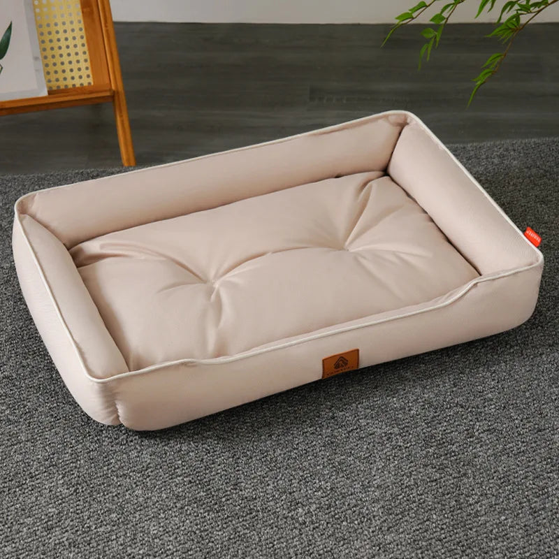 Large plush sofa bed for pets, beige cushion with raised bolsters and piping