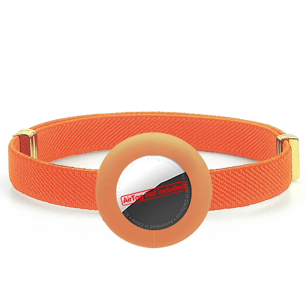 Orange cat collar with AirTag holder, safety breakaway clasp and gold hardware.