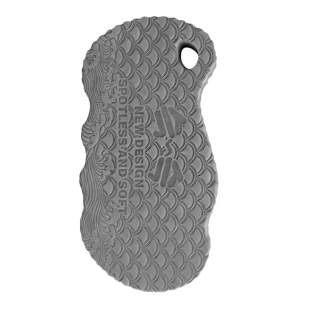 Gray exfoliating bath sponge with embossed scale pattern and thumb hole