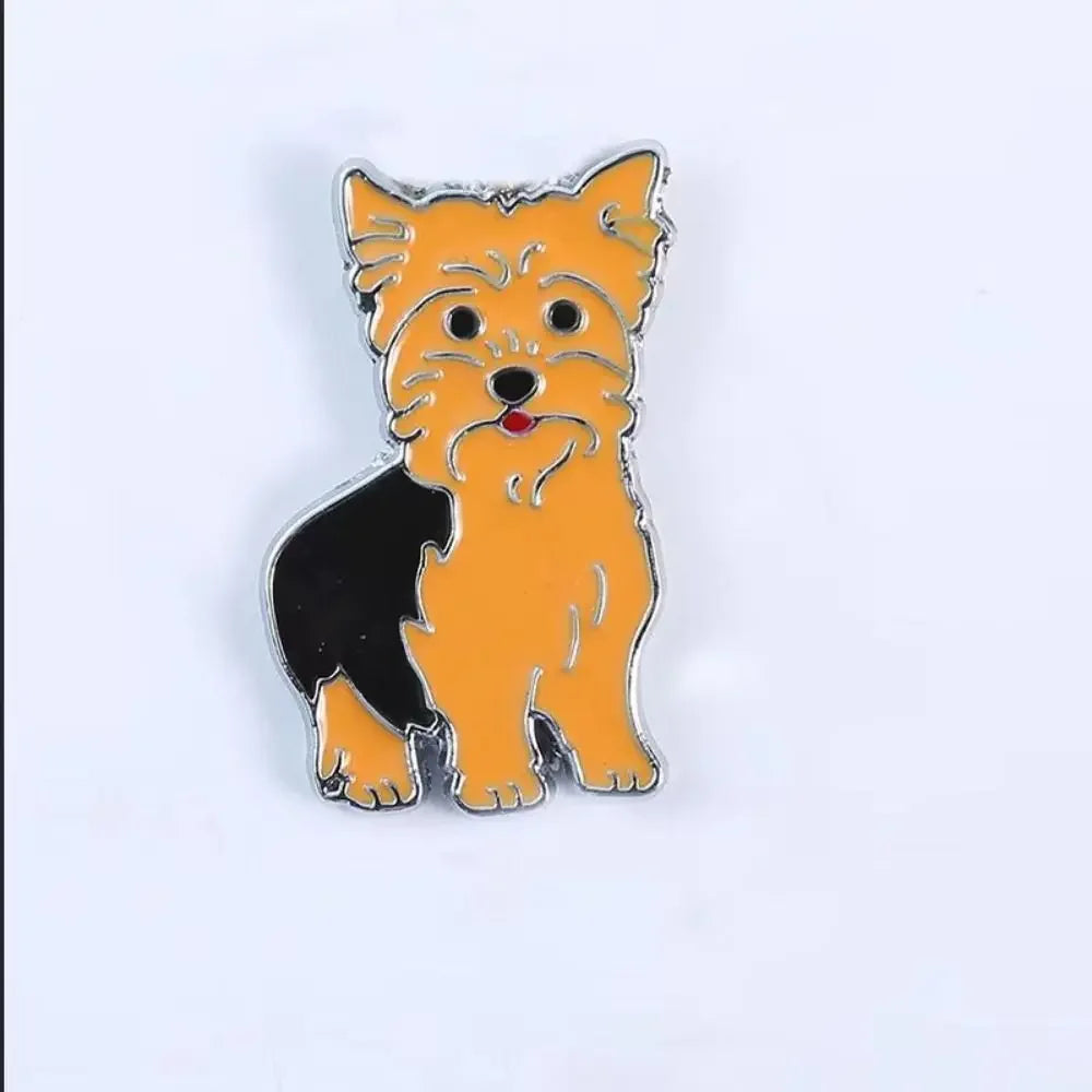 Orange and black cartoon dog enamel pin with silver outline and ears