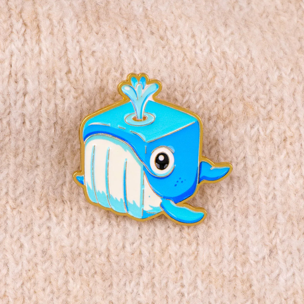 Blue whale enamel pin with white belly and cartoon eye
