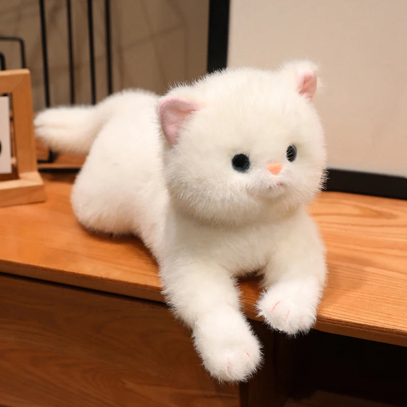 White kitten plush toy with soft fur, pink ears, and embroidered eyes and nose.