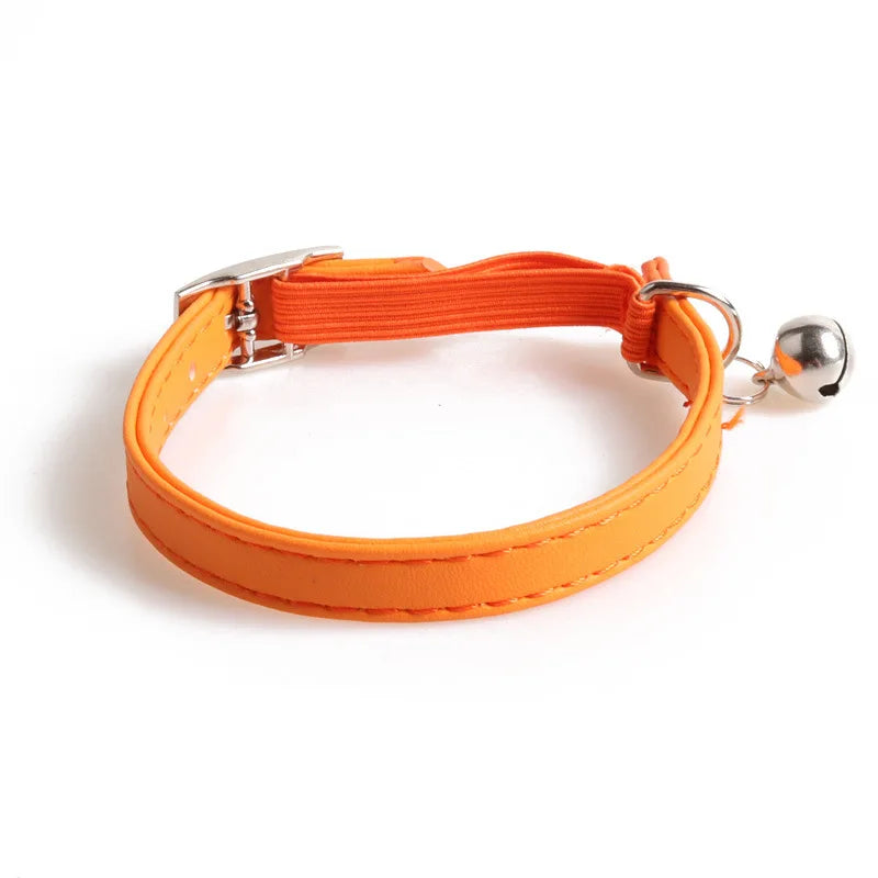 Elastic cat collar with bell; orange strap with metal buckle and ring