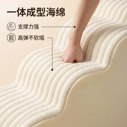 Cream foam pet stairs with textured step surface and a hand pressing for grip