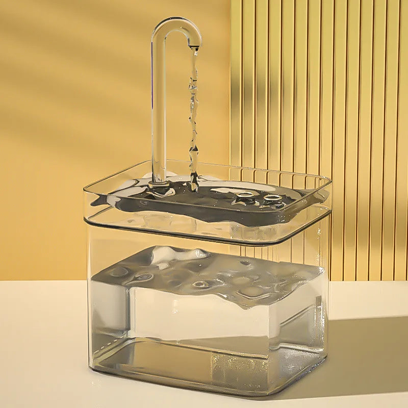 Clear two-level cat water fountain with continuous water flow from the curved spout