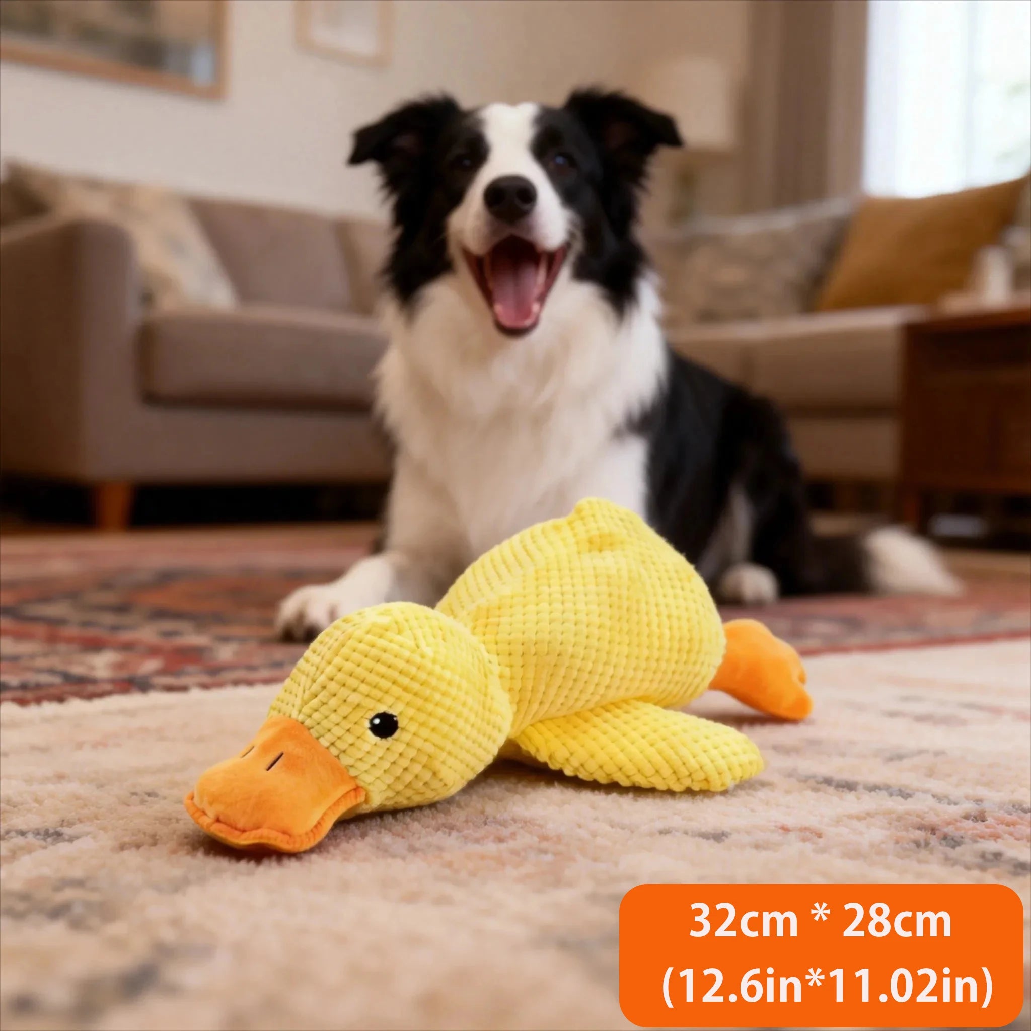 Plush goose squeaky chew toy, yellow textured body with white squeaker section and orange beak.