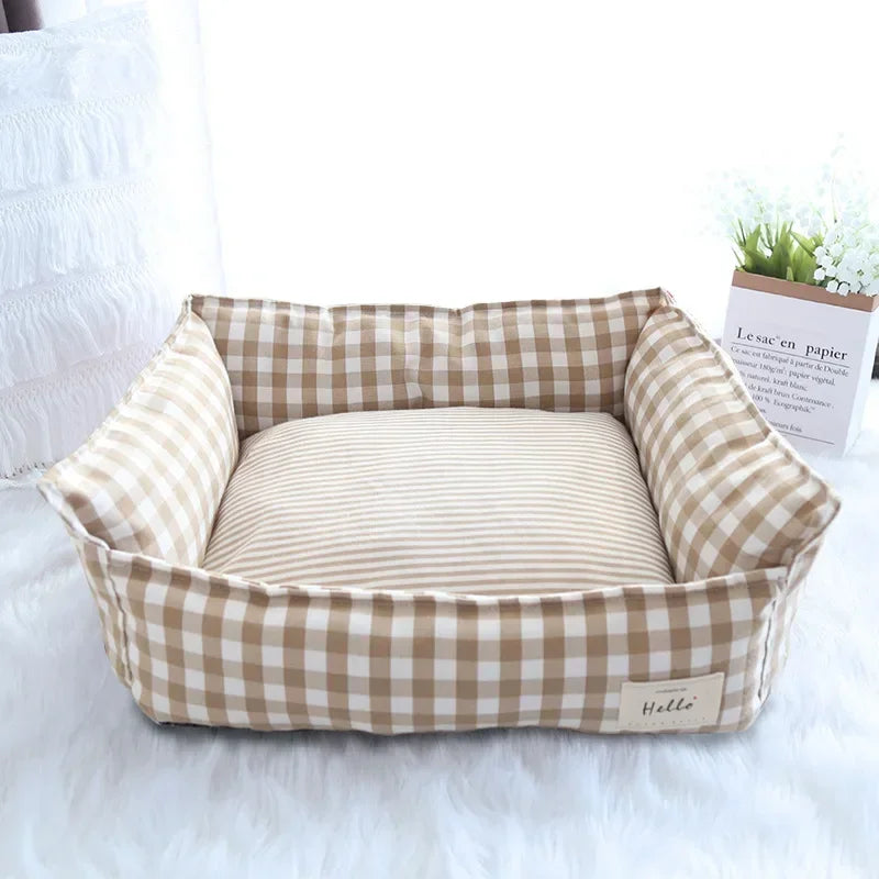 Tan and white checkered pet sofa bed with striped inner cushion and side bolsters