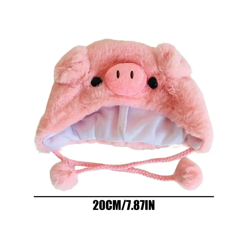 Pink pig plush costume hat for pets with snout face, ear flaps, and chin ties