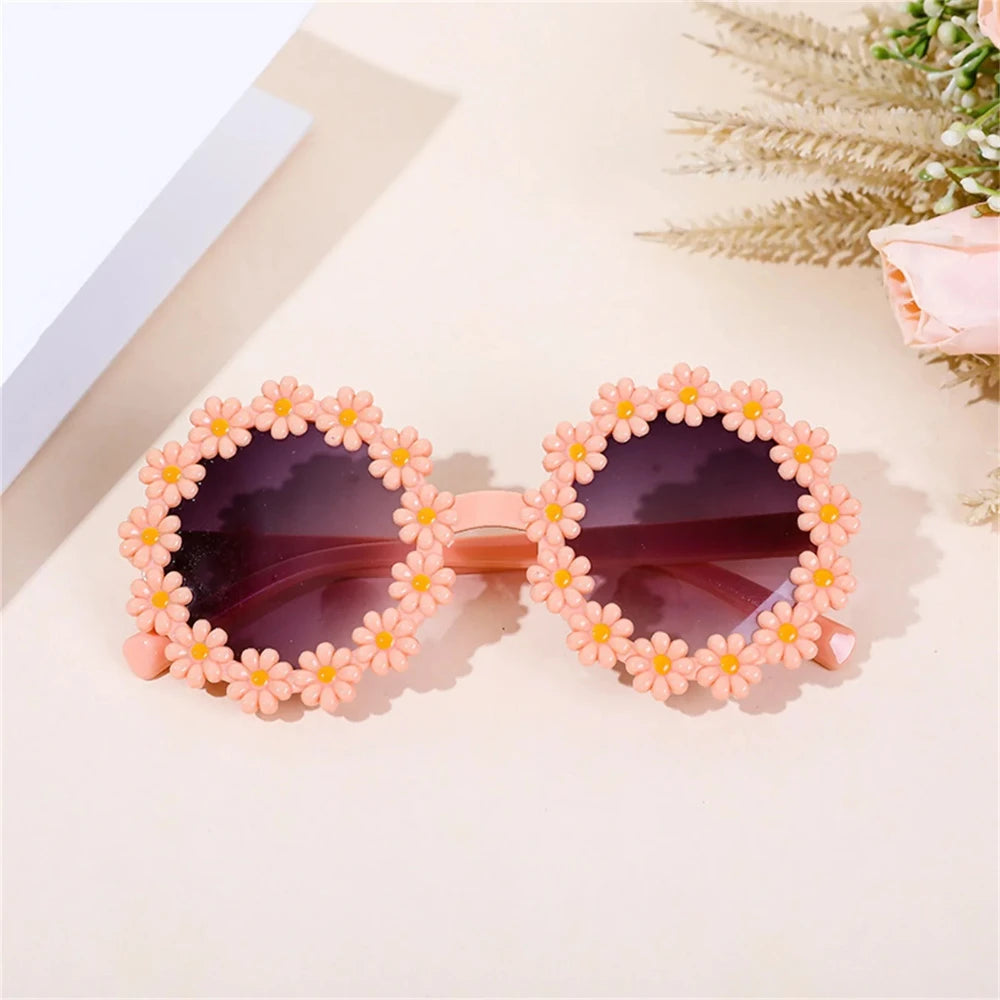 Peach daisy flower sunglasses with dark lenses and pastel flower frame trim