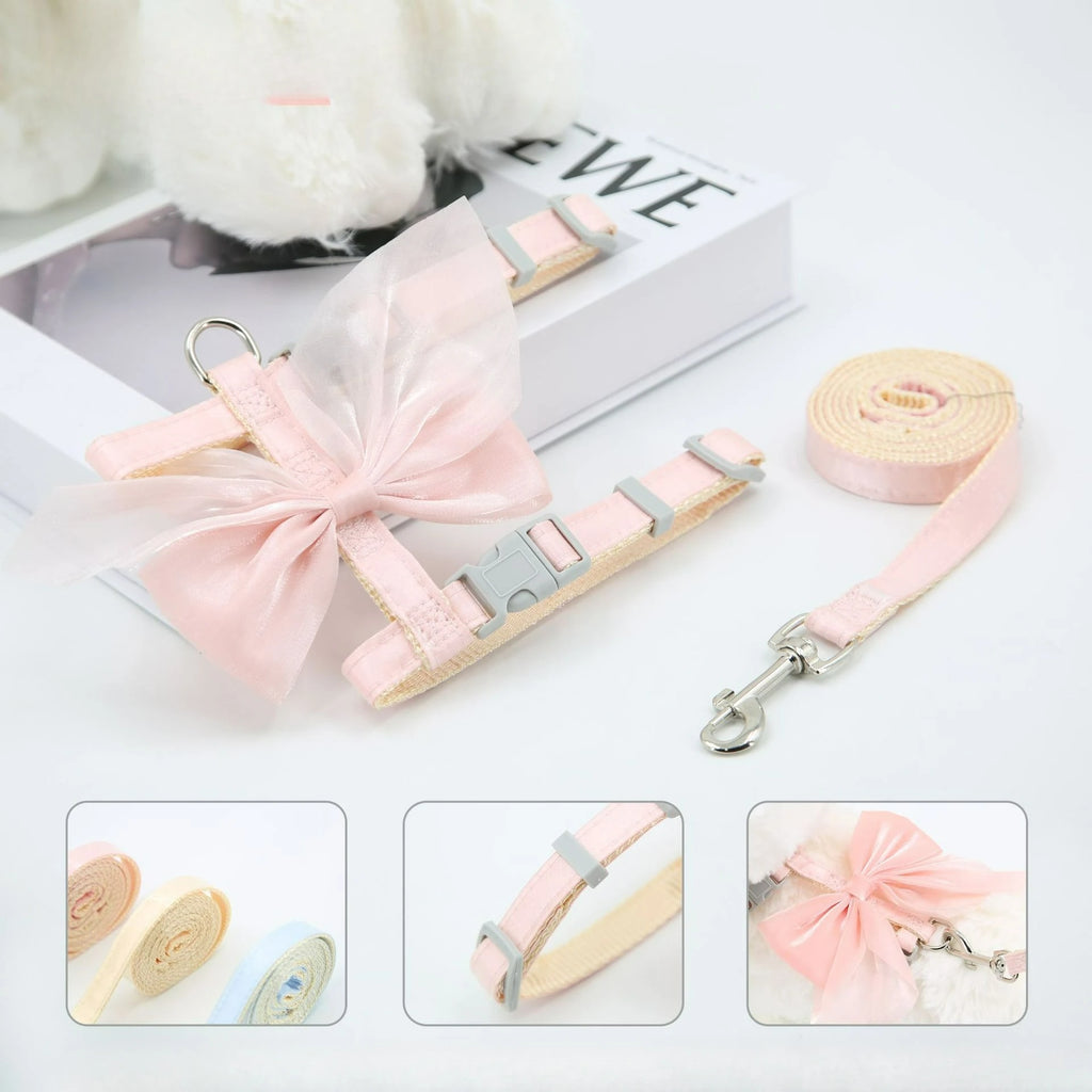 Pink cat harness and leash set with bowknot detail, striped straps, and metal clips