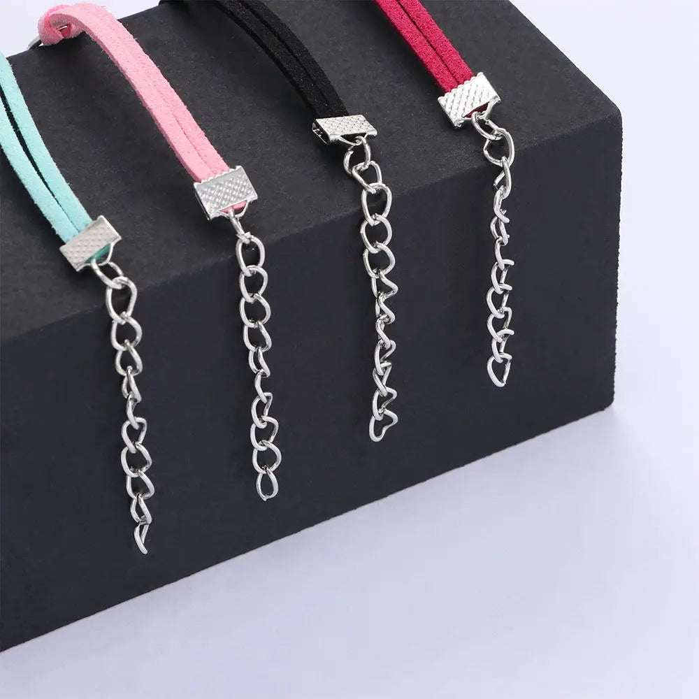 Adjustable pet collars with fabric straps and silver chain; pink, red, and mint styles shown