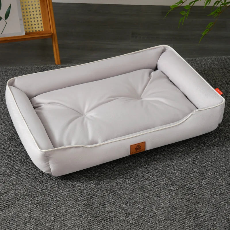 Large plush sofa bed for pets, light gray cushion with raised bolsters and piping