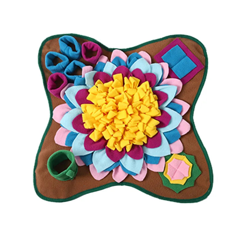 Brown snuffle mat feeder with multicolor felt flower, yellow center, and green edge