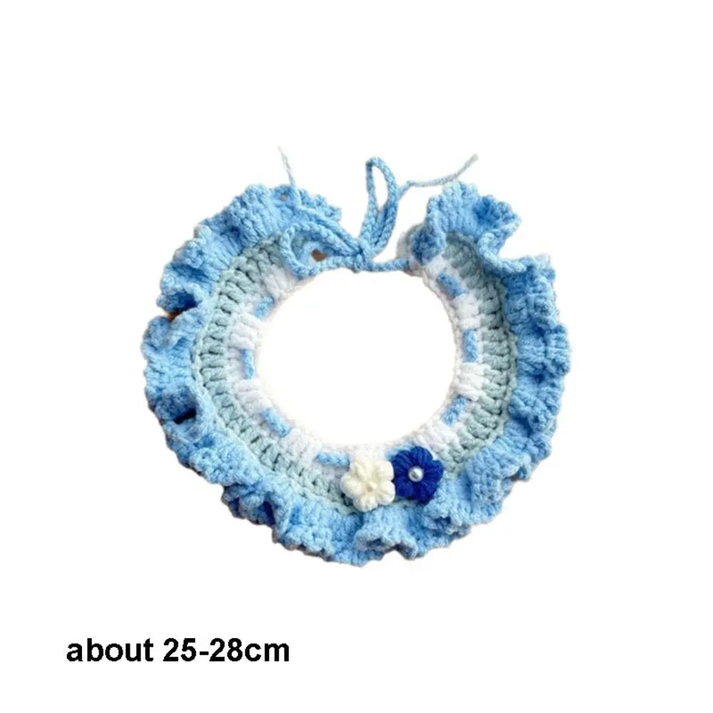 Blue crocheted pet scarf bib with white trim and flower details, size 25–28 cm
