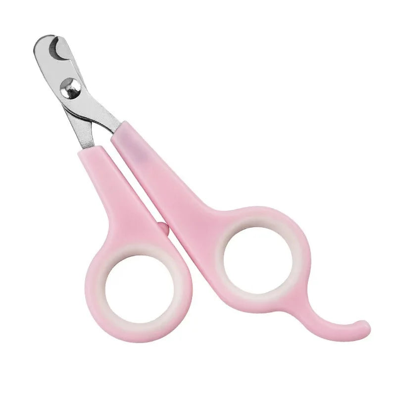 Pink pet nail trimming scissors with silver cutting blades and curved finger loops.