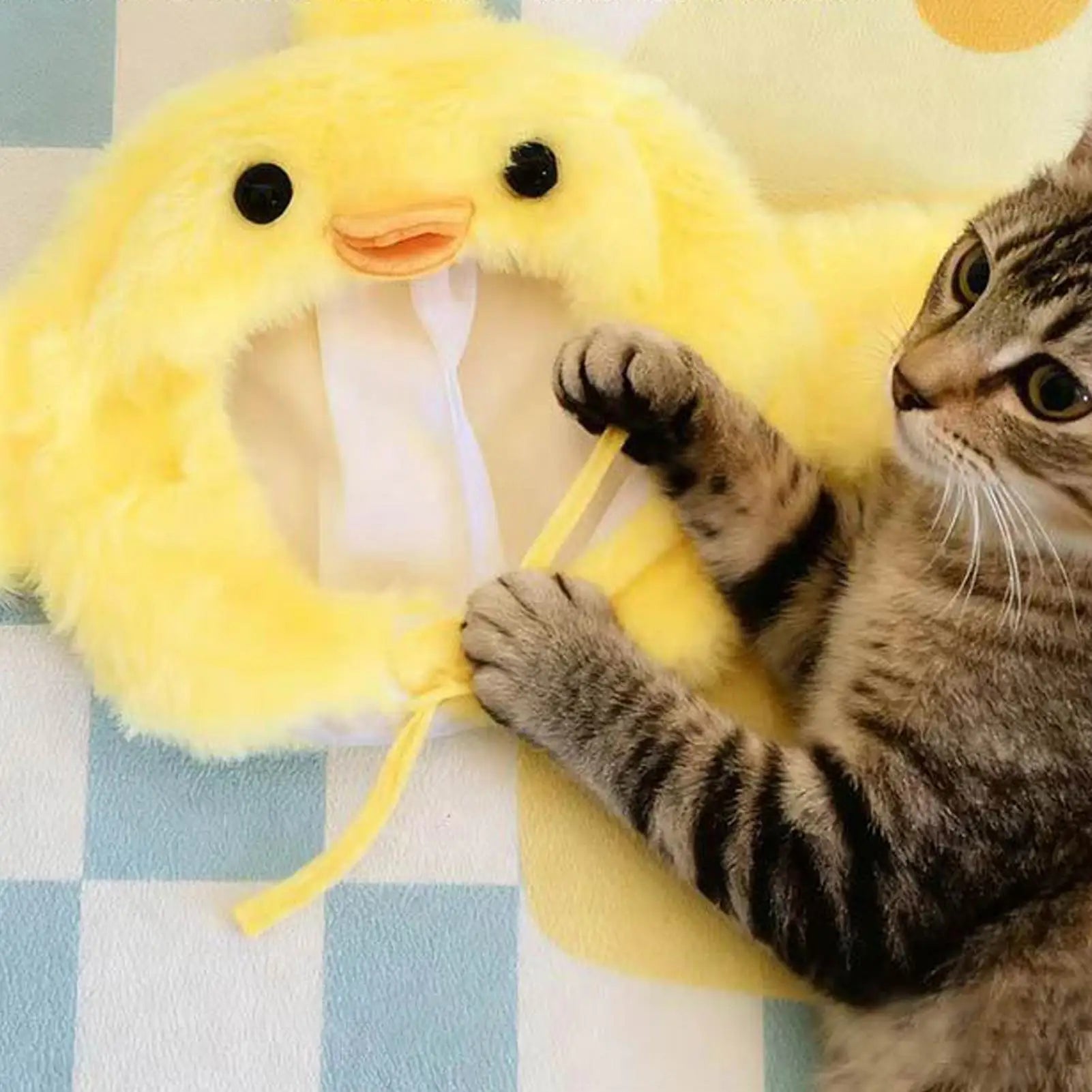 Yellow plush chick costume hat for pets with open face and chin ties