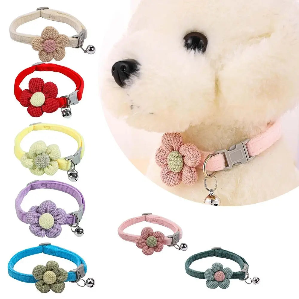 Beige fabric flower cat collar with pink center and dangling bell