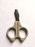 Beige pet nail grooming scissors with dark blades and two finger rings