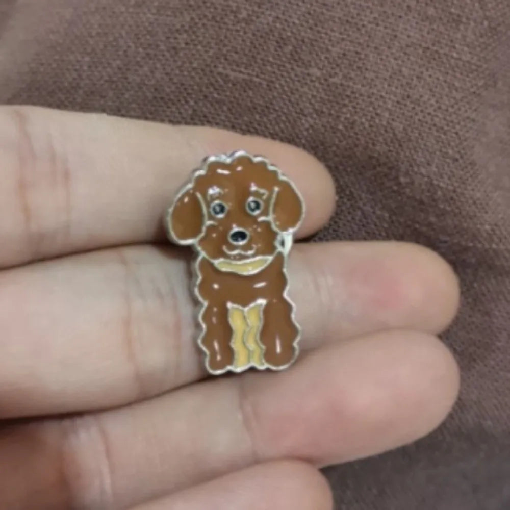 Cartoon brown dog enamel pin with greenish highlights