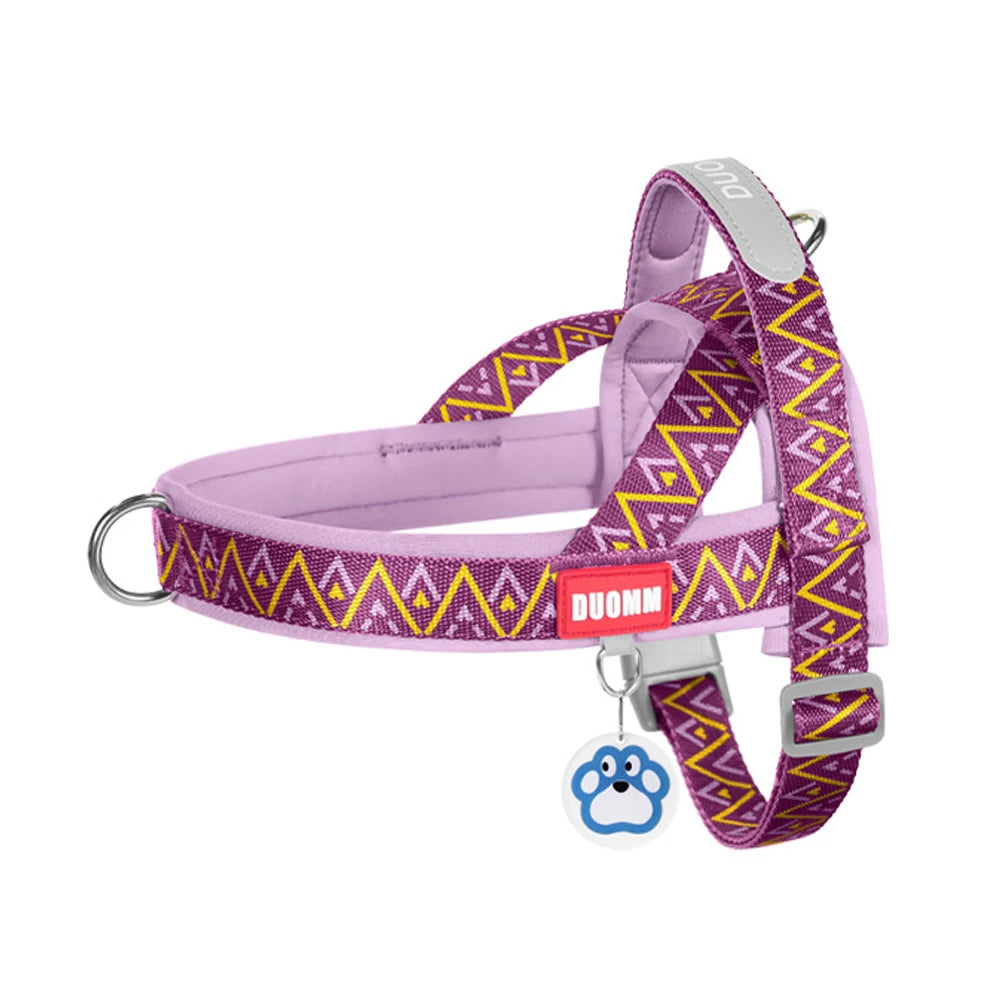 Purple no-pull padded dog harness vest with yellow geometric pattern and D-ring hardware.