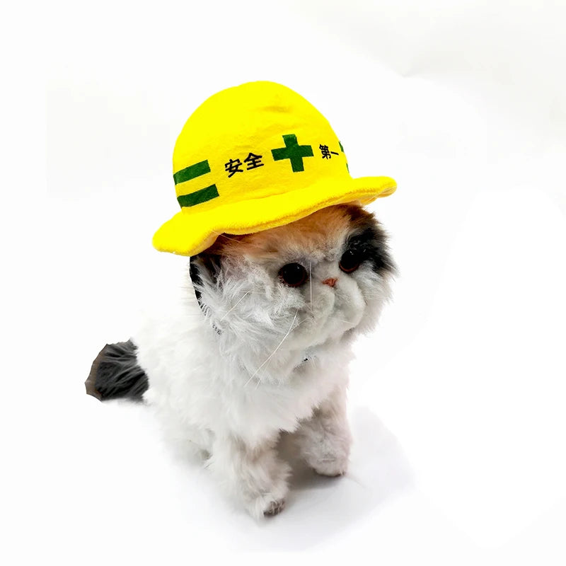 Pet safety helmet hat for dogs and cats on a cat, yellow plush with green cross design