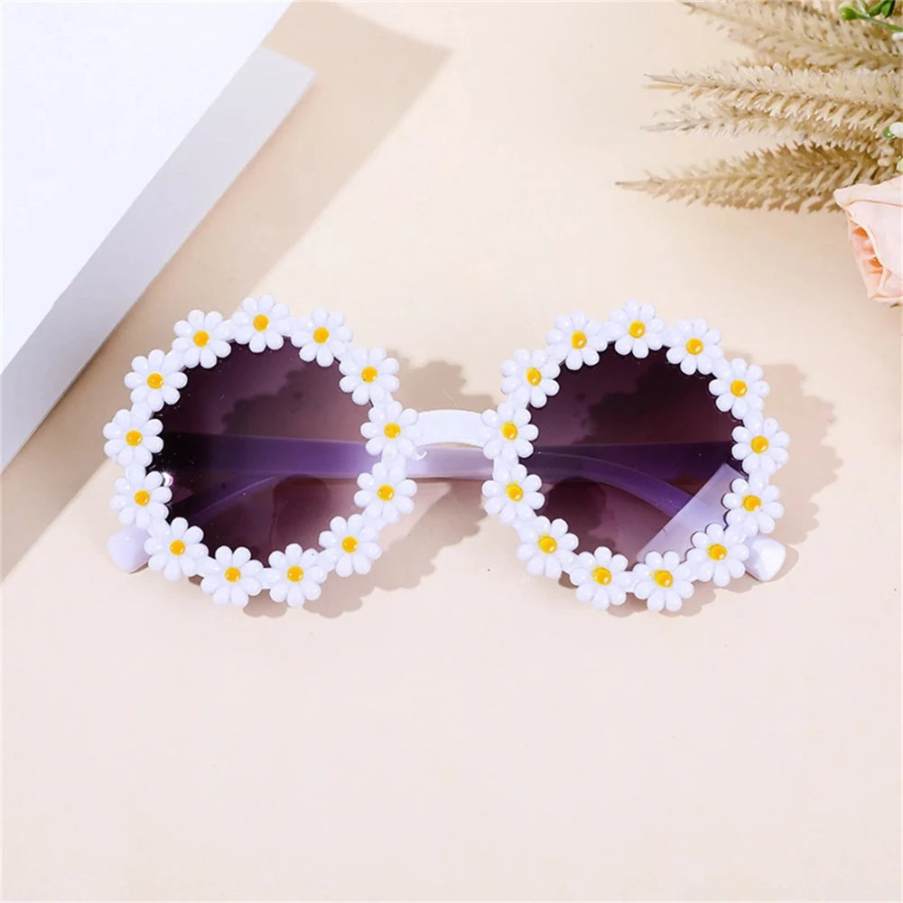 White daisy flower sunglasses with dark lenses and small yellow flower centers