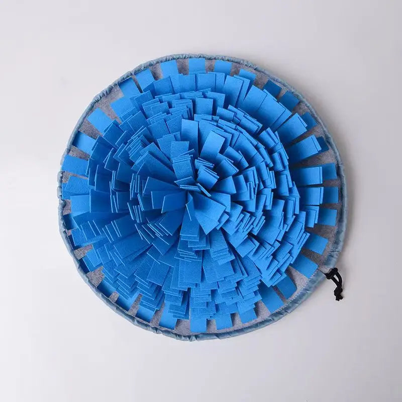 Pet snuffle mat for dogs and cats, round blue fabric foraging mat with textured puzzle strips.