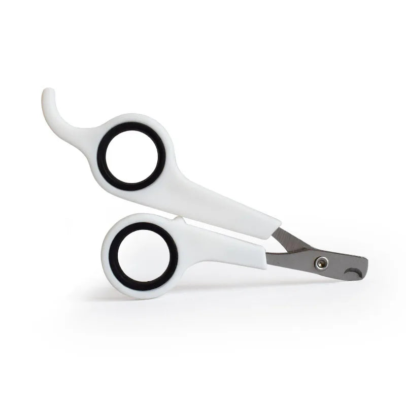 Pet nail trimmer scissors with black rings, white handles and metal cutting blades