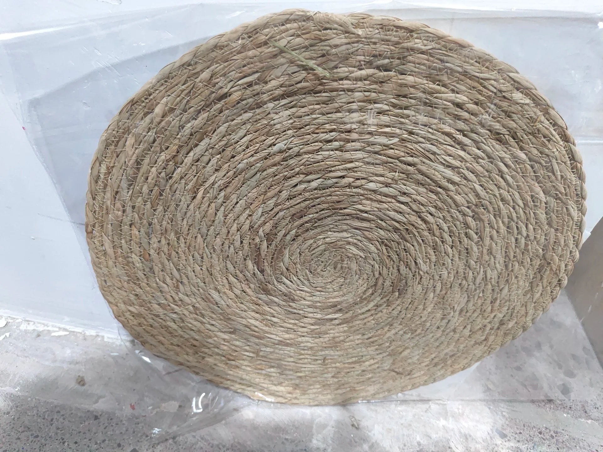 Natural rattan cat scratching mat, round woven top view