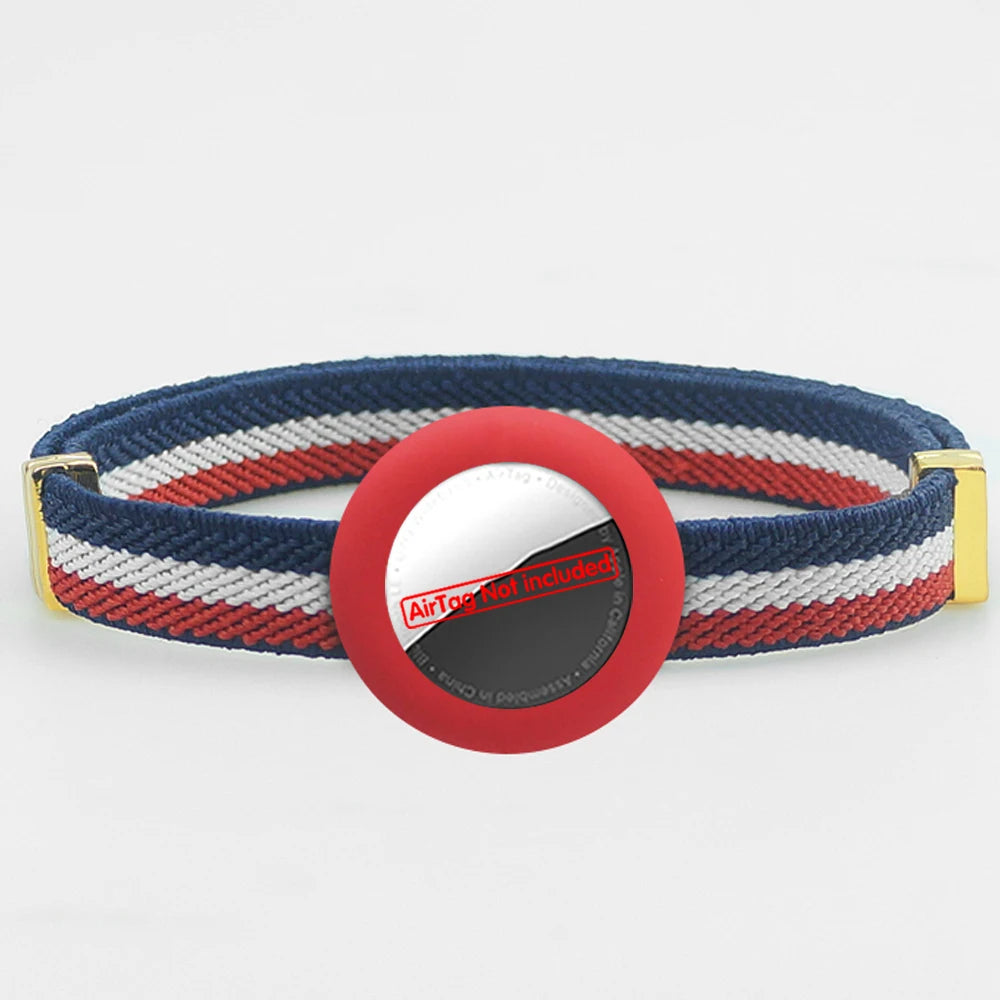 Striped navy cat collar with AirTag holder and safety breakaway clasp, gold hardware.