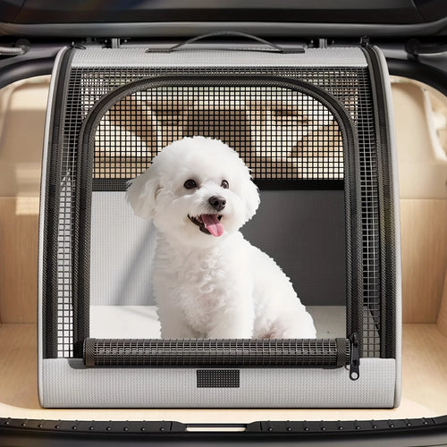 Gray mesh pet carrier with zip front door on a car seat, dog inside.