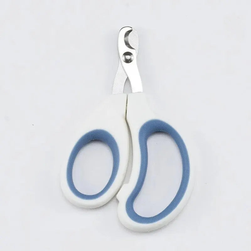 Crescent-shaped dog nail clipper with white grips and blue inner rings, stainless steel blades