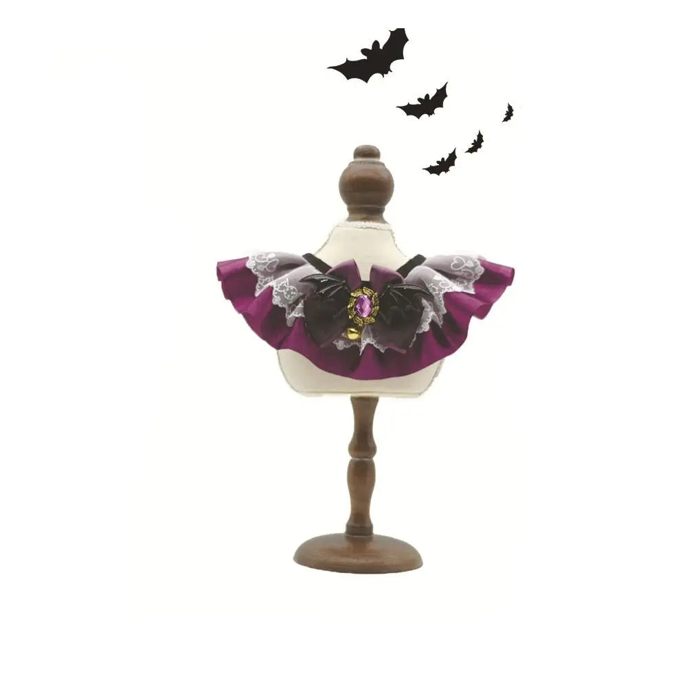 Purple Halloween pet lace collar bib scarf with black bow and ruffled lace trim on stand