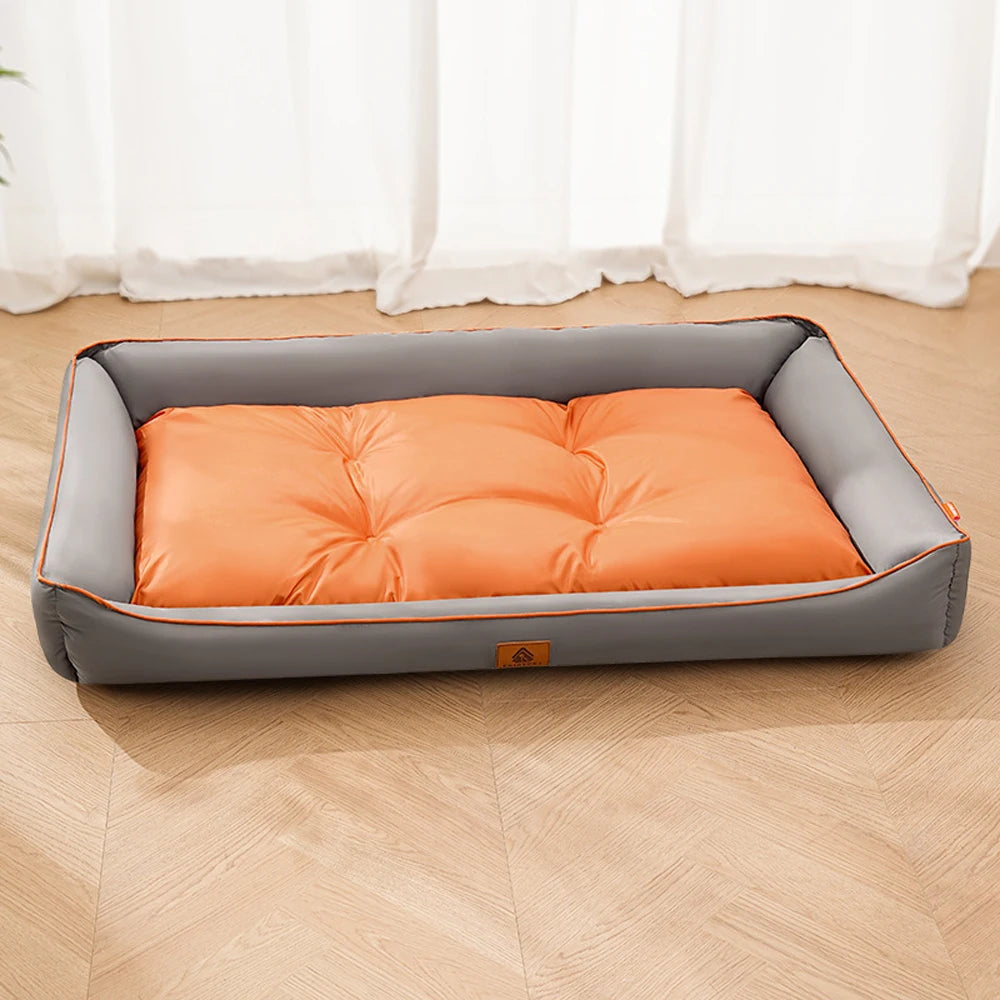 Large plush sofa bed for pets, orange inner cushion with gray bolsters and piping