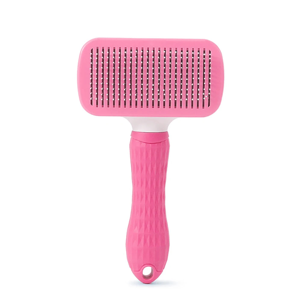 Pink pet hair remover brush with rectangular needle pad and textured grip handle