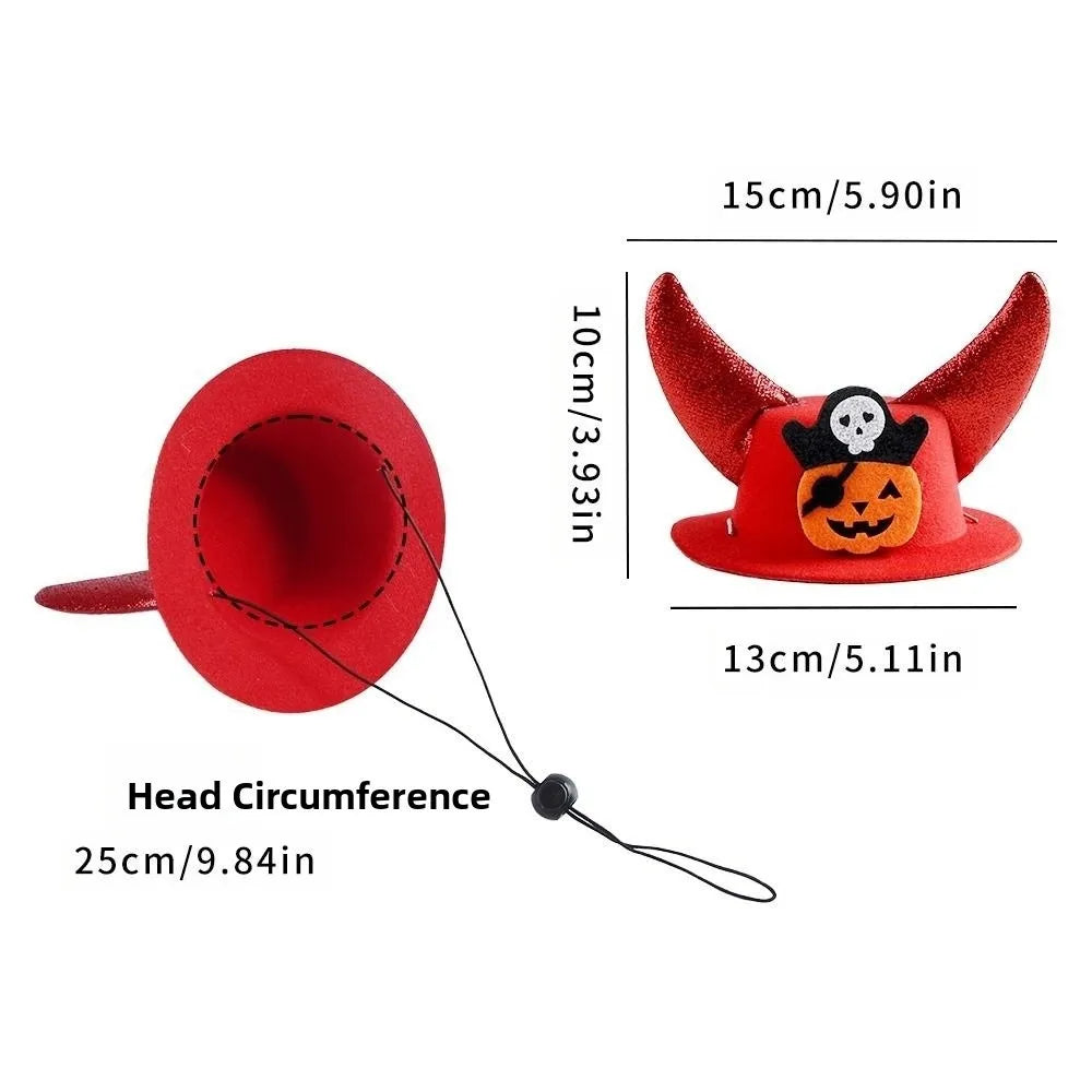 Red pet cosplay hat with horn points, pumpkin face emblem, and chin strap.