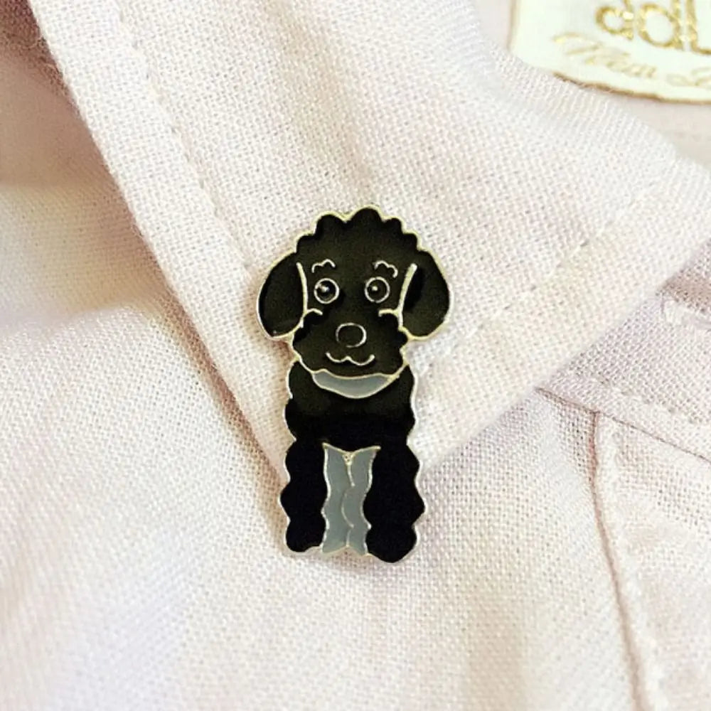Cartoon black dog enamel pin with round eyes and small smiling mouth