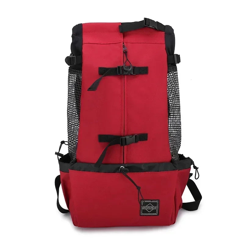 Red dog travel carrier backpack with black mesh sides and front securing straps
