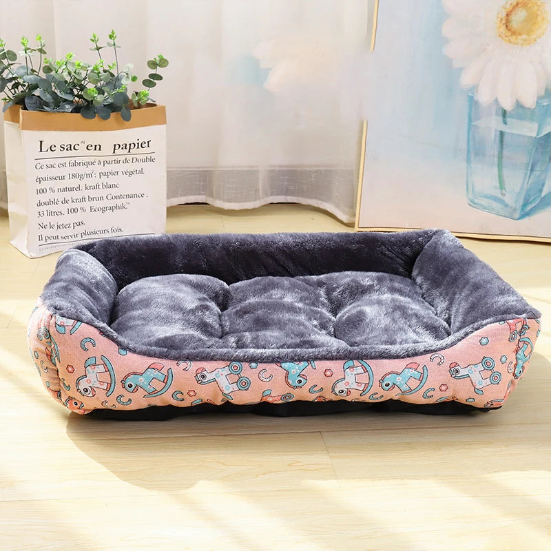 Gray plush dog sofa bed with pink cartoon patterned side fabric, empty inside