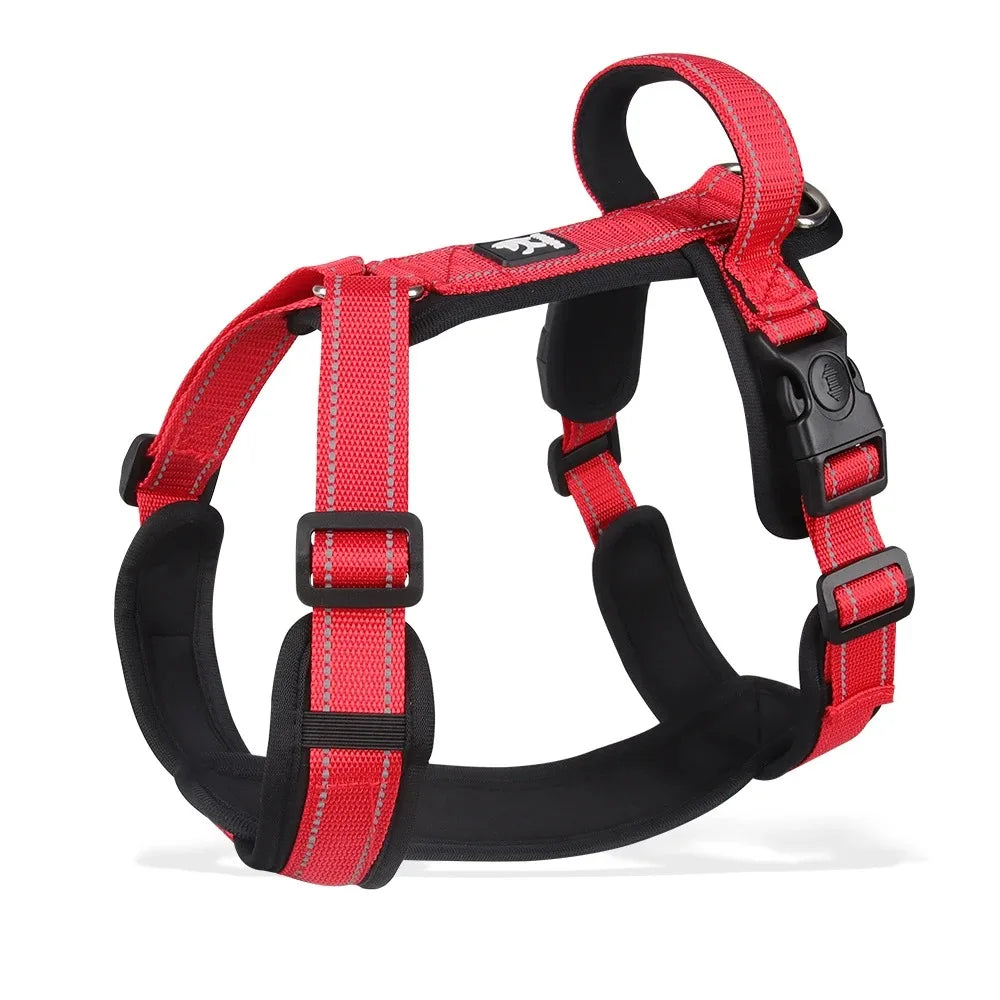 Red dog harness with front chest padding, adjustable buckles, and metal ring